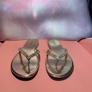 Gold Guess flip flops, 7.5